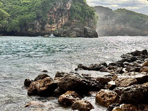 istock Rocky Shoreline and Cliffside View by the Sea 2219809396