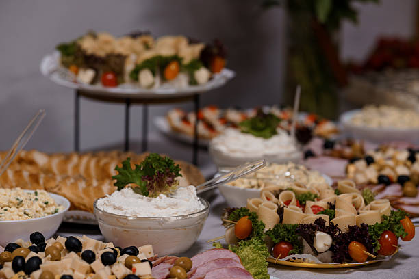 istock Exquisite Catering Buffet Spread with Cheese, Bread, Vegetables, and Appetizers Elegant Party Food Presentation, Dark Background 2219809403