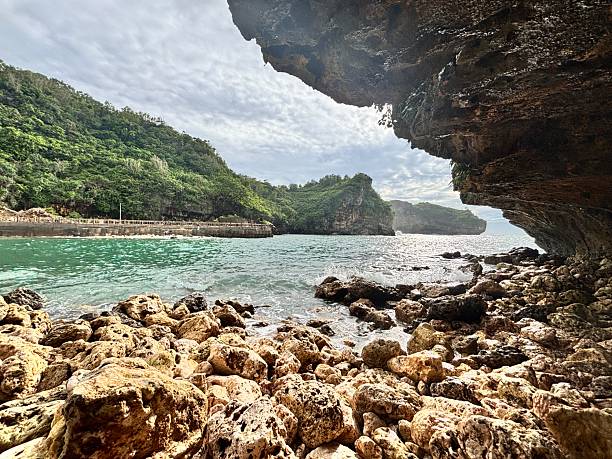 istock Rocky Shoreline and Cliffside View by the Sea 2219809463
