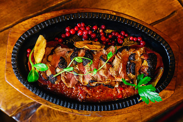 delicious meat dish with sauce on a plate. top view
