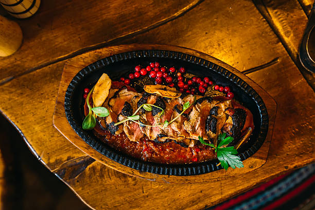 delicious meat dish with sauce on a plate. top view