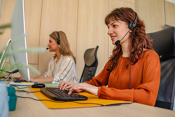 istock Businesswomen collaborating in a modern office setting with advanced technology and professional focus 2219812258