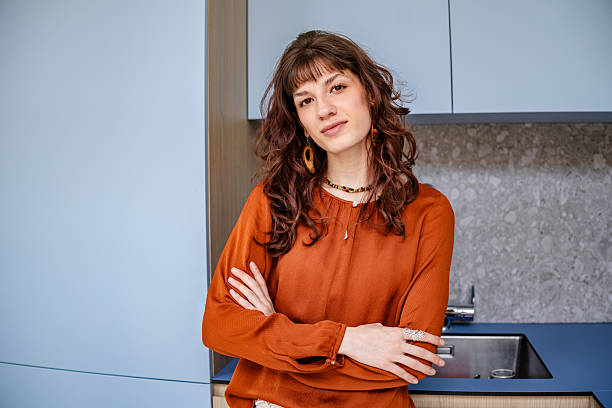 istock Businesswoman in a modern office expressing confidence while posing against a stylish backdrop 2219813169