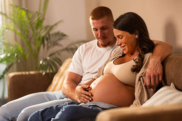 istock Expectant Couple Sharing a Tender Moment at Home 2219813636