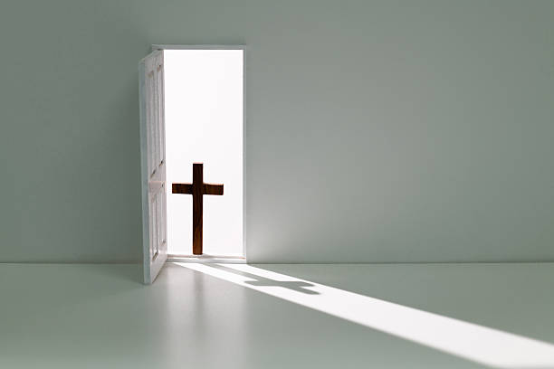 istock Open door with a religious cross 2219813934