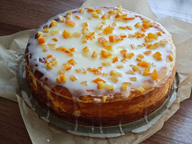 Cheesecake with icing and candied orange peel