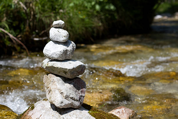 stacked stones in the bank of a river