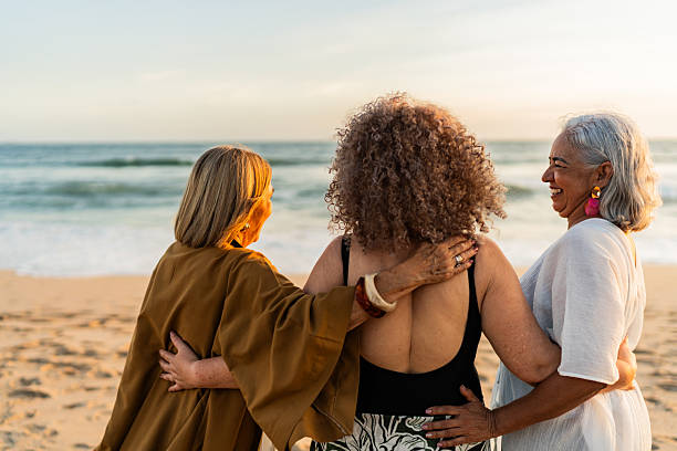 istock Senior friends women talking on the beach 2219821955