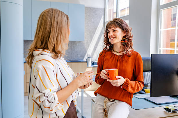 istock Women collaborating and discussing ideas in a modern office environment during daylight hours 2219822623