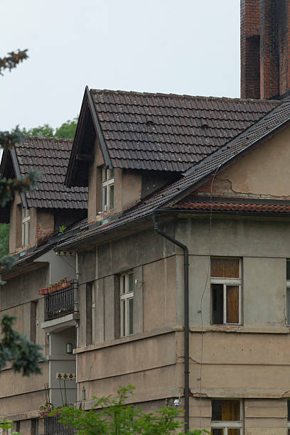 istock A neglected and abandoned residential building featuring a sloped roof 2219823000