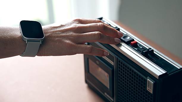 Close-up shot of a vintage radio showcasing its speaker, buttons, and classic design.