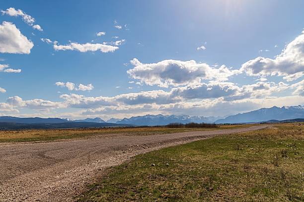 istock Sunshine Glowing Over A Country Road 2219824491