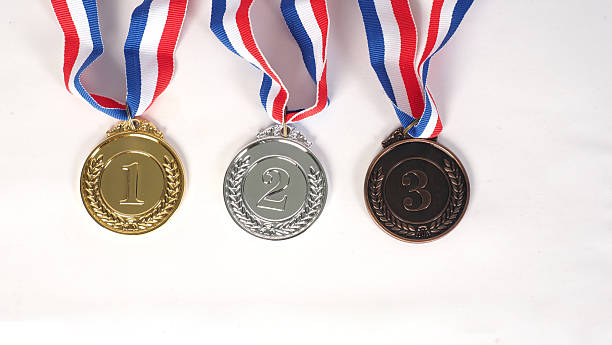 istock Three medals in gold silver and BRONZE medals on white background 2219825222