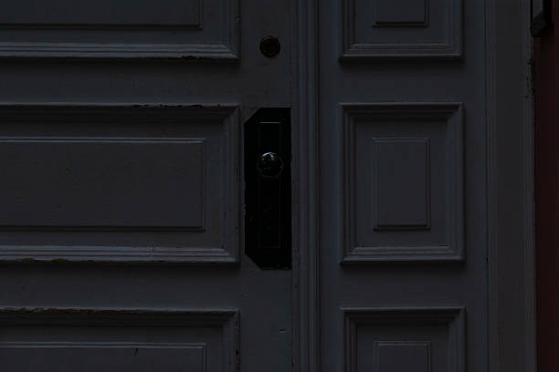 istock This is a Detailed View of a Dark Door featuring a Handle for access 2219825695