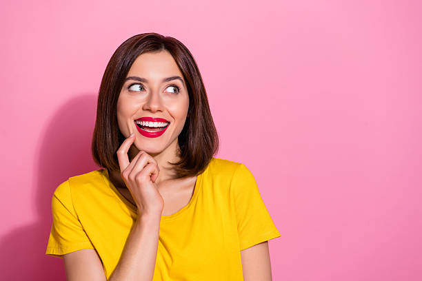 istock Portrait of attractive cute cheerful girl deciding copy empty space solution isolated over pink pastel color background 2219826573