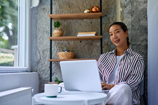 istock Young Asian Woman Working From Home Using Laptop 2219827417