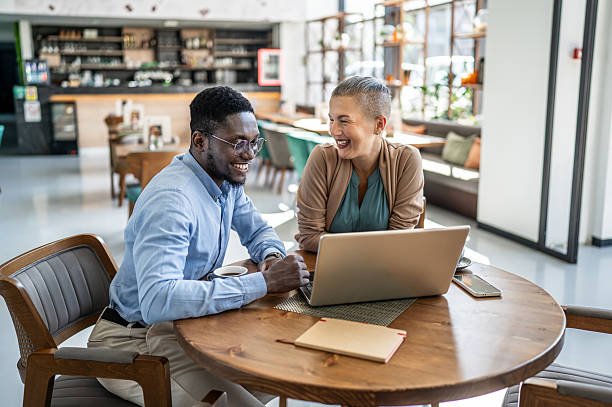istock Business people working on laptop in cafe 2219828987
