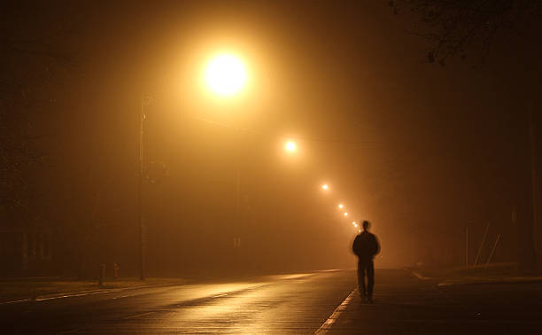 istock Foggy Street Light Walking 2219829974