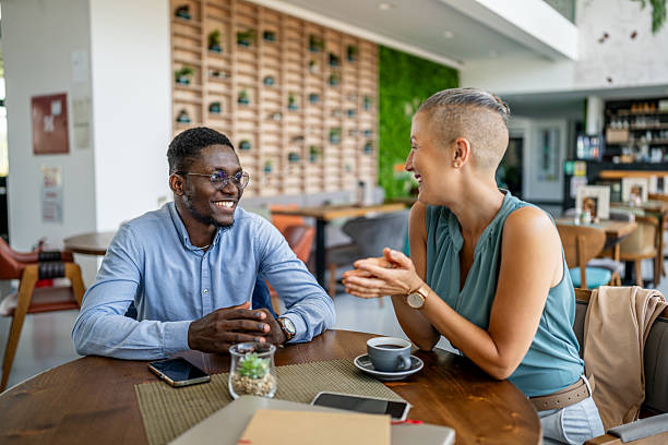 istock Business partners enjoying a coffee break, discussing new project in a cafe 2219830097