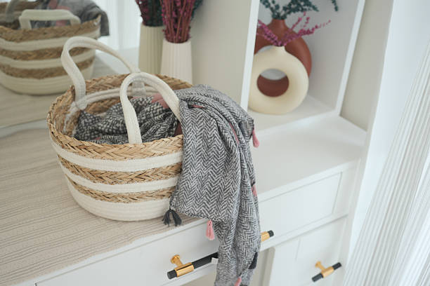 istock Decorative storage basket with a cozy scarf and warm decor elements 2219831805