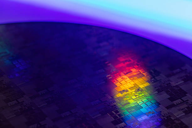 istock Macro Shot of a Silicon Wafer during Semiconductor. Silicon Wafers with microchips used in electronics for the fabrication of integrated circuits 2219832077