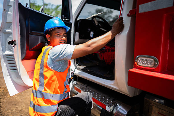 istock Portrait of a construction worker climbing into a dump truck 2219832521