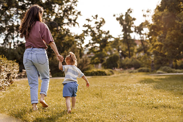 istock Loving Mom and Daughter Playing Together Outside 2219833001