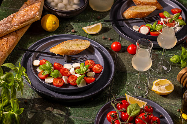 istock Fresh italian caprese salad with bread and lemonade 2219837367