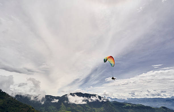 A tourist paragliding in the mountains of Jericó, Antioquia, Colombia