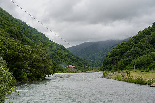 istock Thick clouds over the mountains, a river between the mountains 2219838616