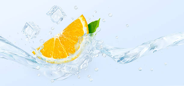 istock Orange slice with ice cubes and water splash on light blue background. 2219840680