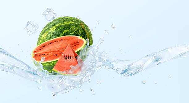 istock Ripe watermelon, ice cubes, water splash isolated on light blue background 2219840723