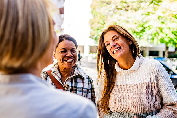 istock Friends talking on the street 2219841414