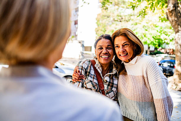istock Friends talking on the street 2219841424