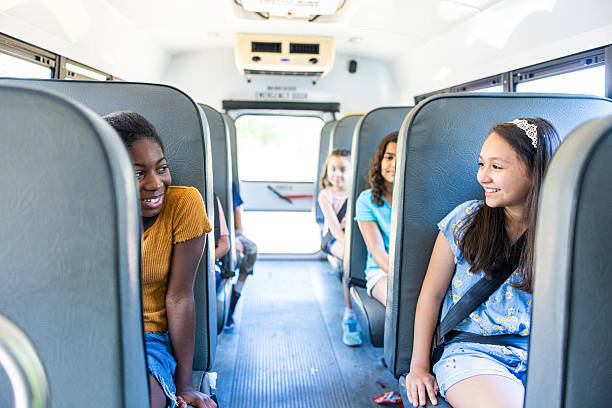 istock Diverse children sitting on the school bus seats 2219845640