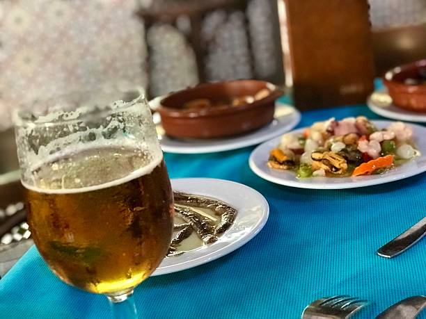 istock Glass of lager and Spanish tapas 2219846787