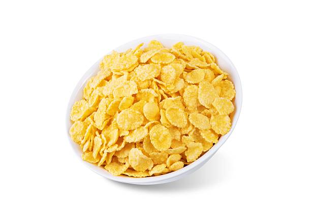 istock Cornflakes in a white bowl on a white isolated background 2219848877