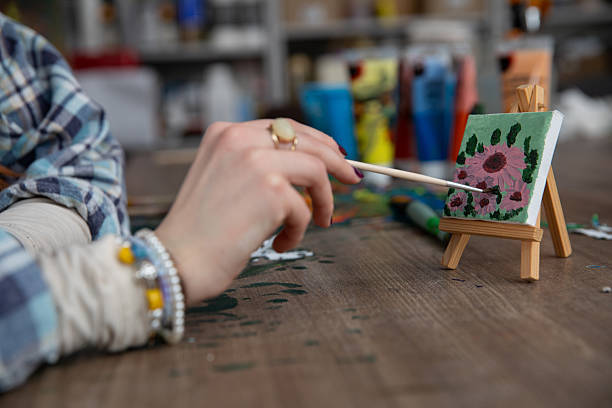 istock Creative Hands Engaged in a Fun and Enjoyable Painting Activity that Sparks Imagination 2219850824
