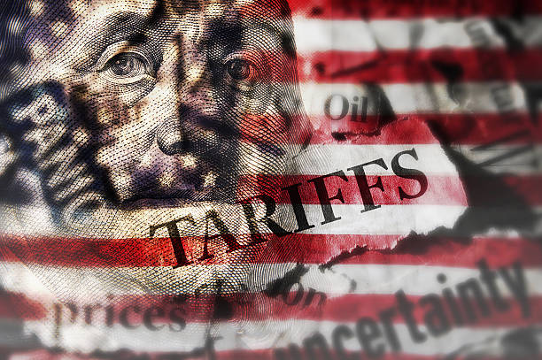 istock Tariffs news headlines and hundred dollar bill over an American flag 2219854080