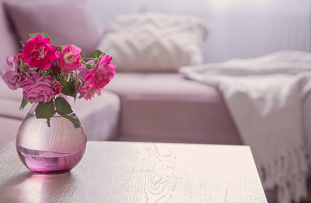 istock cozy interior with pink roses in glass vase 2219854556