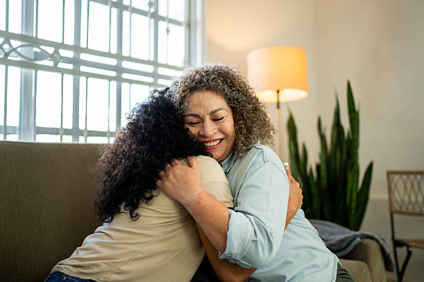 istock Senior mother embracing daughter at home 2219857769