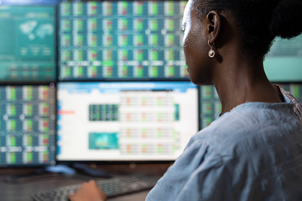 istock Black investor analyzing trading charts 2219858304