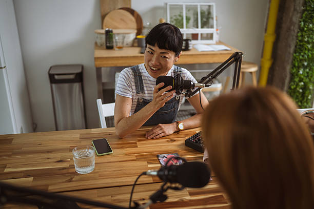 istock under the shoulder view of japanese host record podcast at home studio 2219859724