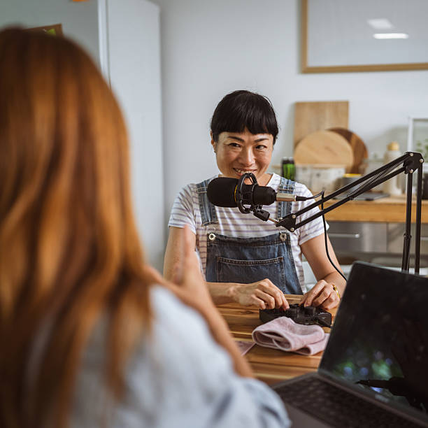 istock under the shoulder view of japanese host record podcast at home studio 2219859765