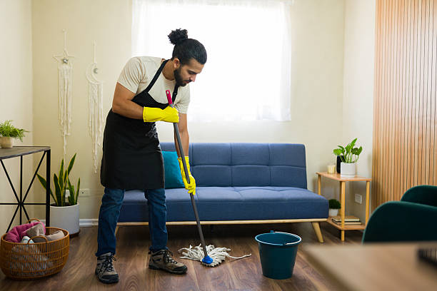 istock Janitor cleaning floor with mop in modern apartment 2219861212