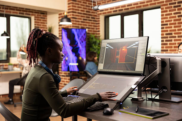 istock Focused woman refining designs on screen 2219862506