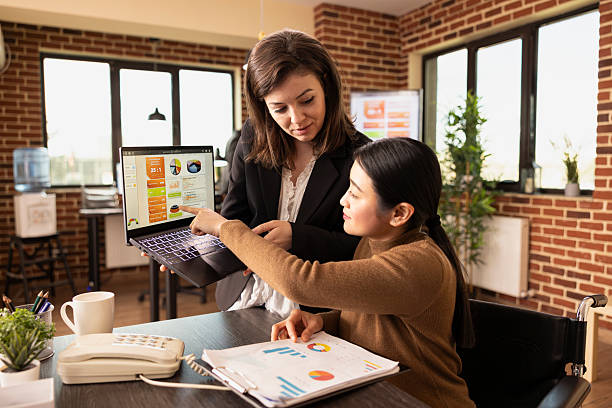 istock Businesswomen using laptop and documents 2219865884