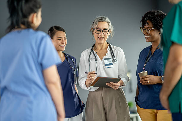 istock Medical Team Engaged in Collaborative Discussion in a Hospital Setting 2219866273
