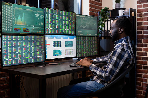 istock Black man monitoring forex charts 2219867536