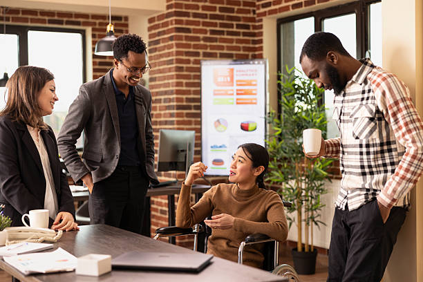 istock Multiethnic employees bonding in office 2219867859